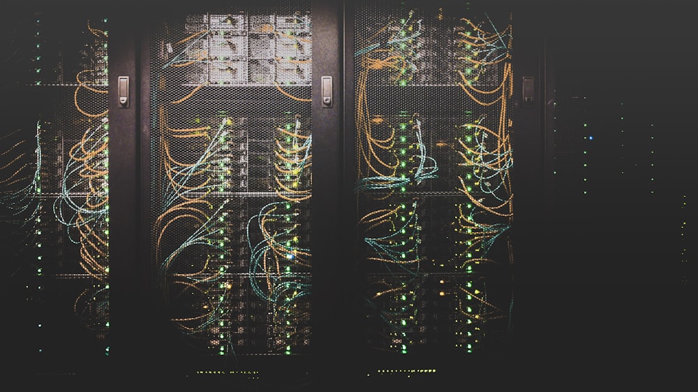 Rows of modern server racks illuminated by dark and warm lights